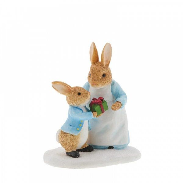 Mrs. Rabbit passing Peter Rabbit a present
